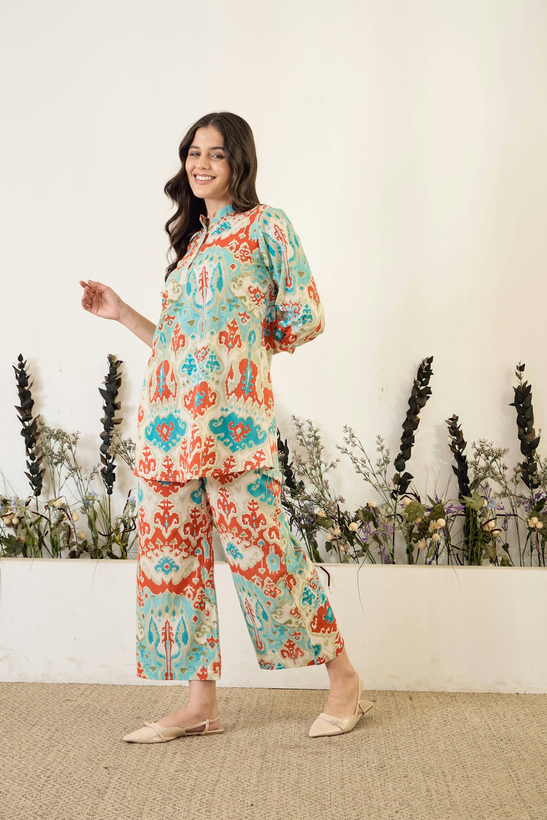 IMANA Ikaat Printed Co-Ords featuring a turquoise blue & red mandarin-collar top with matching palazzo. Elegant, breathable & effortlessly chic.